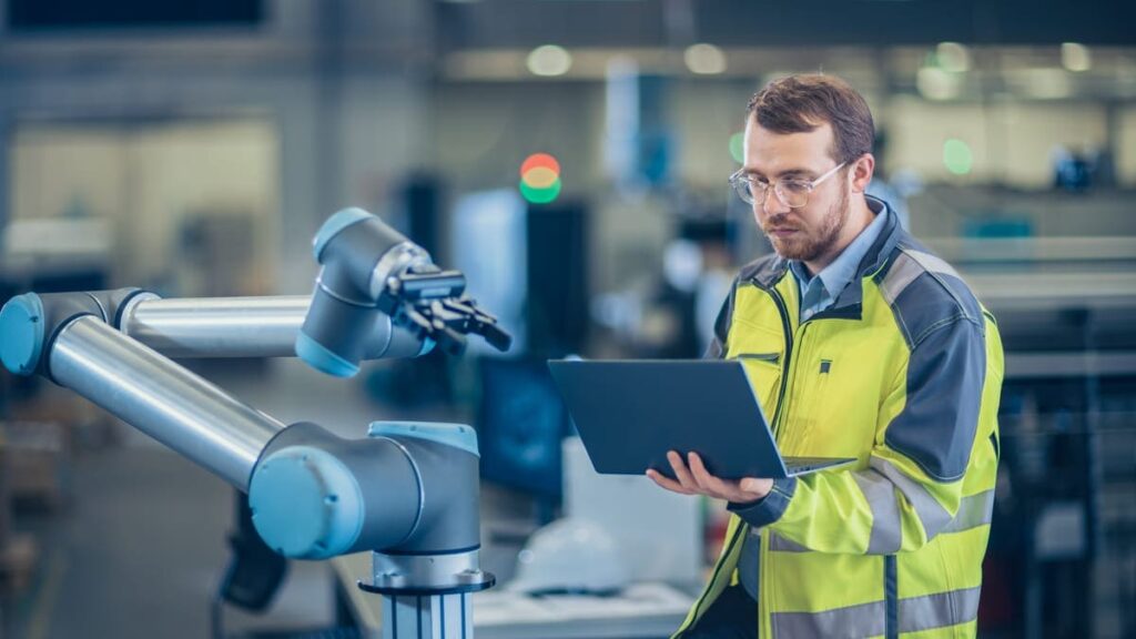 Operator manipulating a collaborative robot